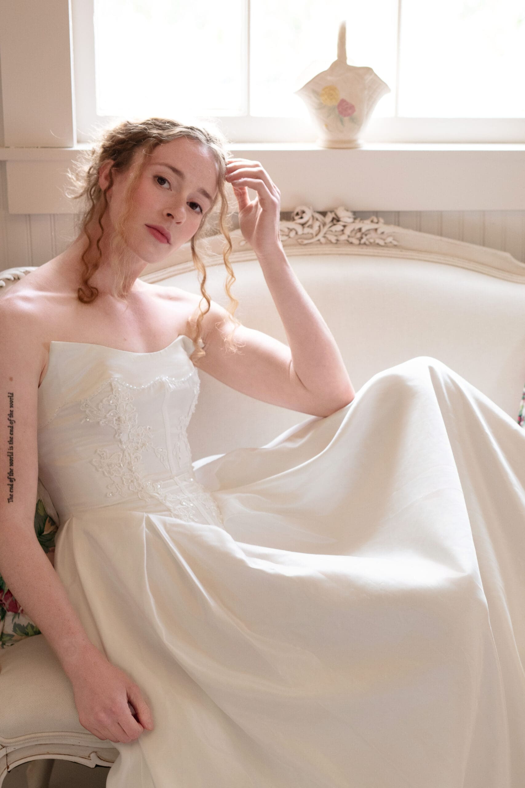 Quiet bridal portrait captured in soft light at a Christianson's Nursery wedding.