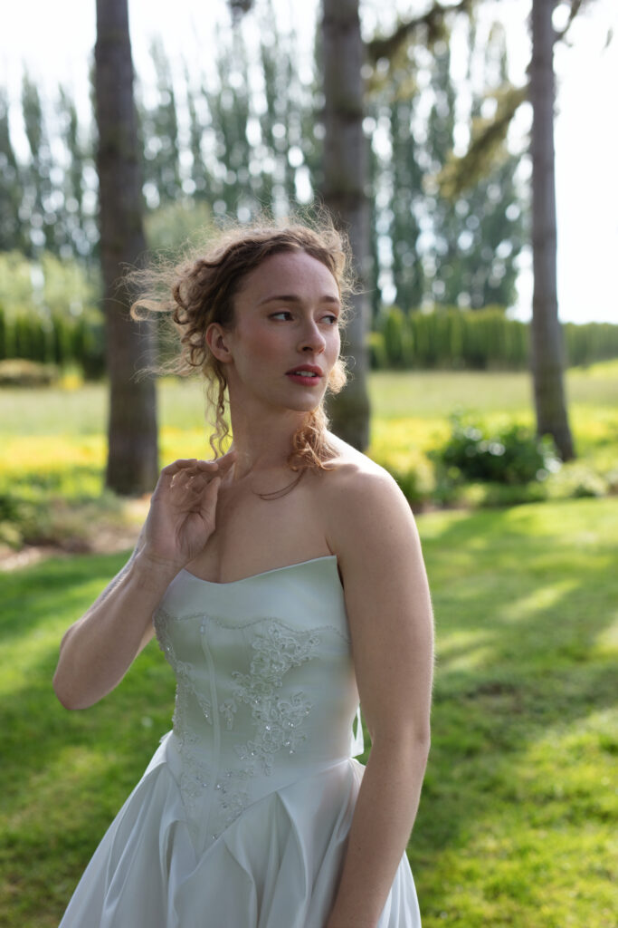 Bridal portrait taken at Christianson’s Nursery wedding, with natural sunlight filtering through the trees in the Skagit Valley.