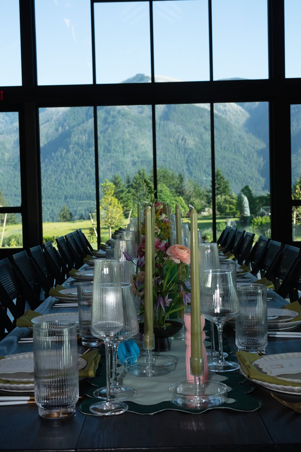 Elegant reception table framed by panoramic windows and Columbia Gorge mountain views.