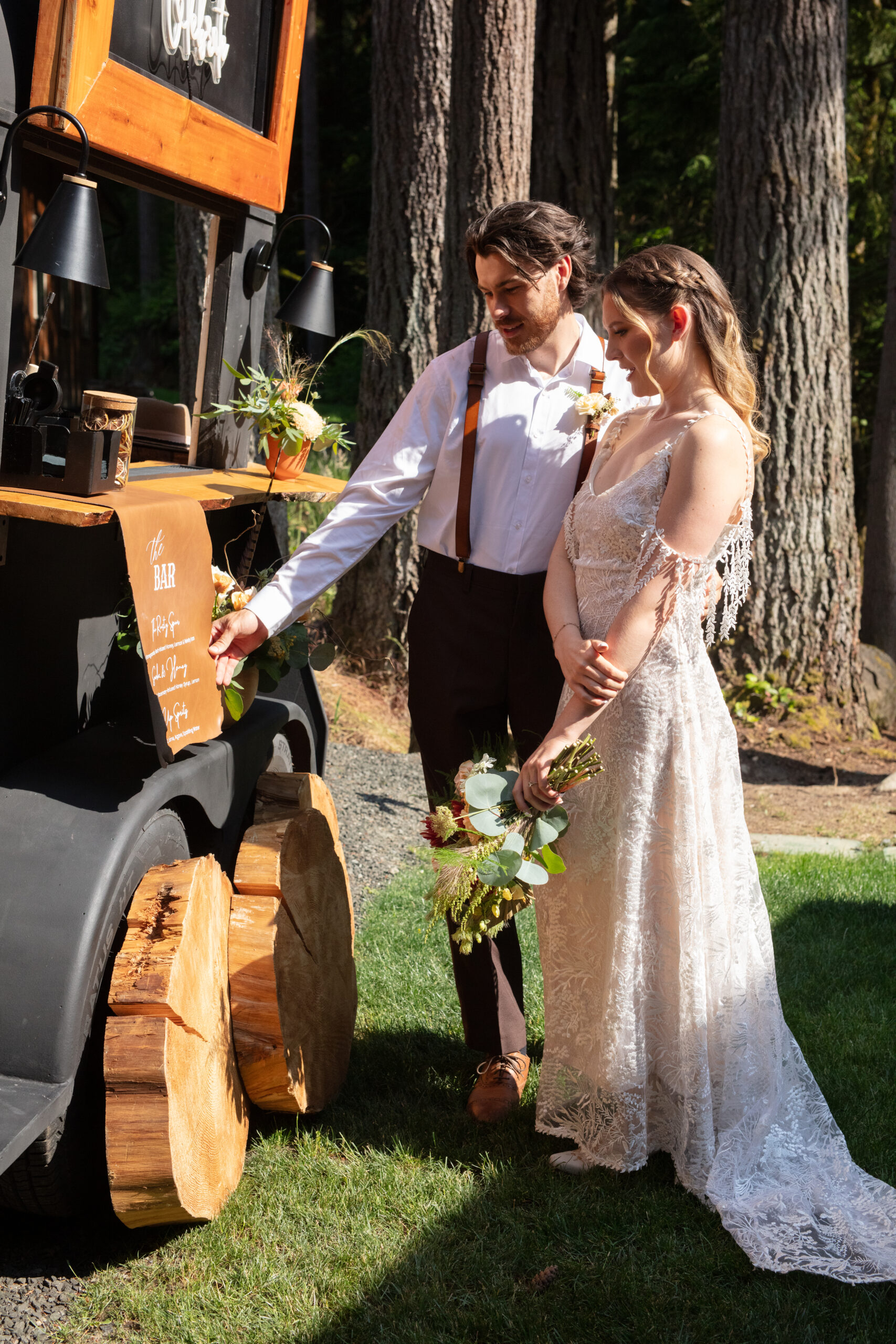 Couple sharing a moment at their custom wedding bar—personalized celebration details that offer great ideas for weddings.