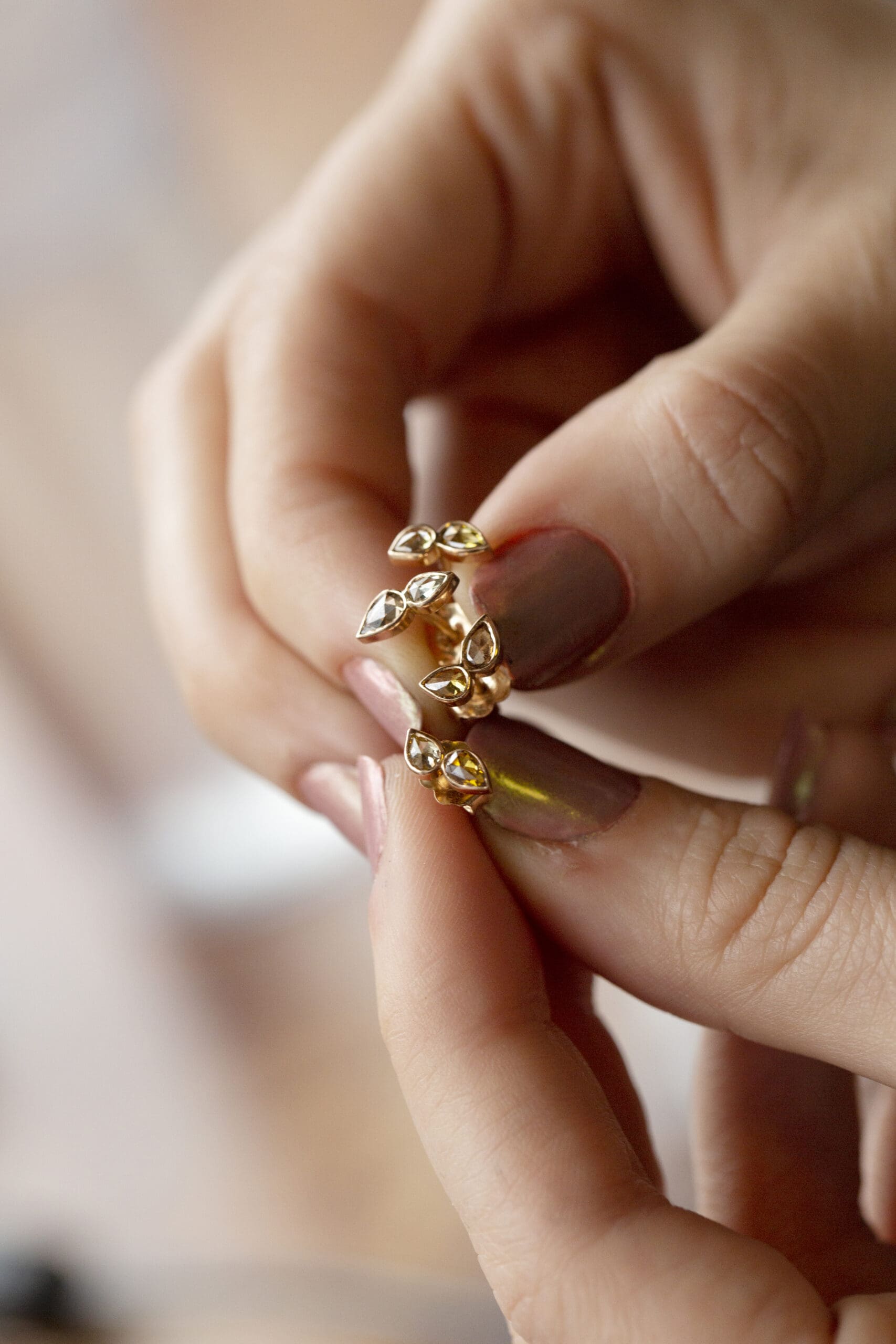 Bride holding a meaningful family heirloom ring, a timeless way to add emotional depth to your wedding day.