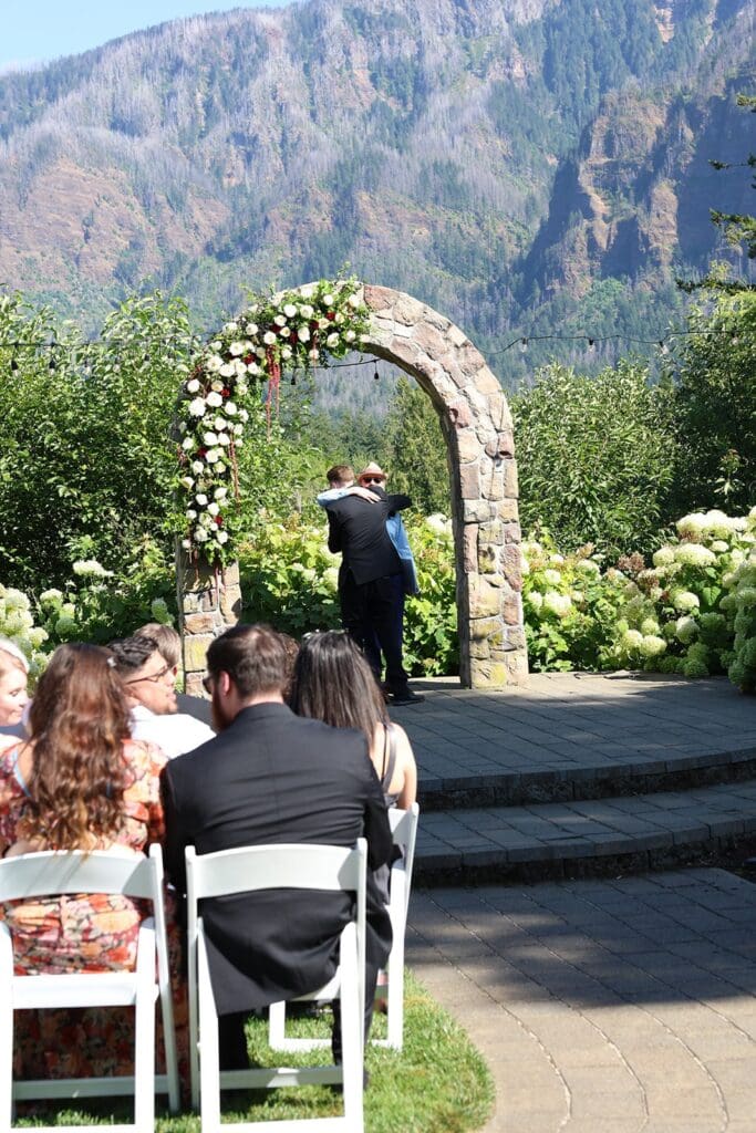 Couple embracing at alter after intimate wedding ceremony at Washington wedding venue
