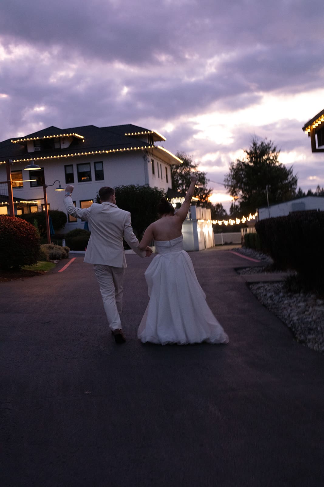 Just married energy as this couple celebrates their wedding in Washington state with a joyful walk into the evening light.